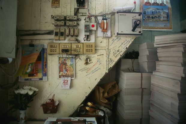 11_Still life with telephone numbers, moving poster and stacks of unfolded cement knife boxes